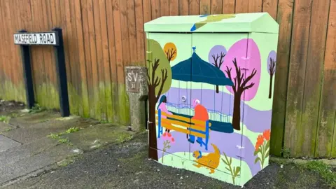 Carroll Weston/BBC Cabinet painted with a bandstand, a pink tree and seated figures