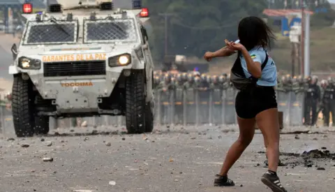 EPA Venezuelan demonstrators clash with the Bolivarian National Guard on border with Brazil