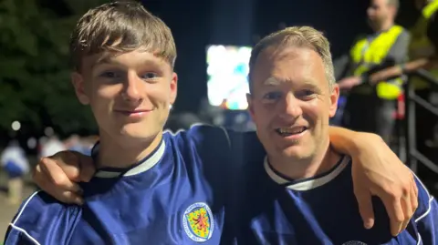 Ewan Brown and his son Jamie had been enjoying their time in Stuttgart until the 100th minute of the match