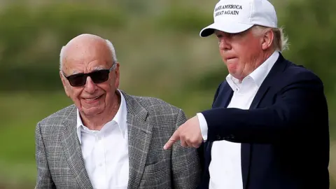 Reuters Republican presidential candidate Donald Trump (R) speaks to media mogul Rupert Murdoch as they walk out of Trump International Golf Links in Aberdeen, Scotland, June 25, 2016