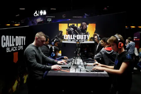 Reuters Gamers play Call of Duty: Black Ops 4 at the Paris Games Week (PGW) in 2018