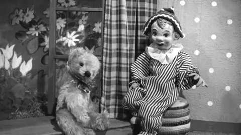 Ben Productions A black and white still of Andy Pandy and Teddy on the set of the original Andy Pandy show.