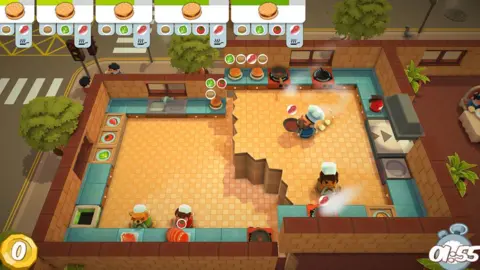 Ghost Town Games A scene from Overcooked, showing four chefs trying to make burgers