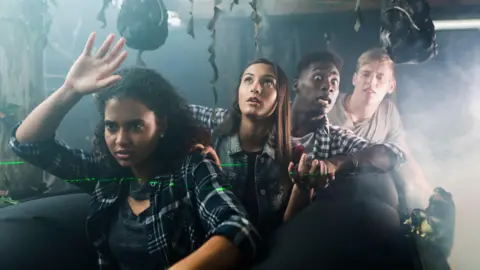 Getty People on ghost train ride