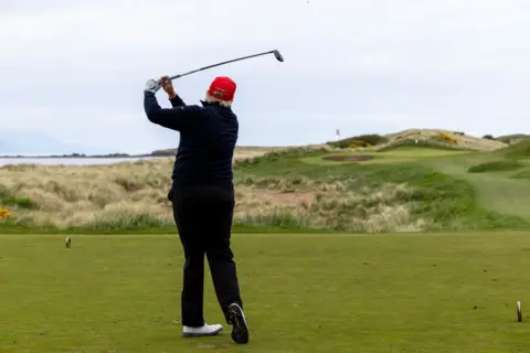 Getty Images Donald Trump playing golf at Turnberry