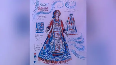 Kat Dooney An artist's sketch of how the illuminated puppet will look. It is blue and orange colour and features Harriet, a Fleetwood trawler, on her skirt and marine life in a nod to Fleetwood's fishing heritage