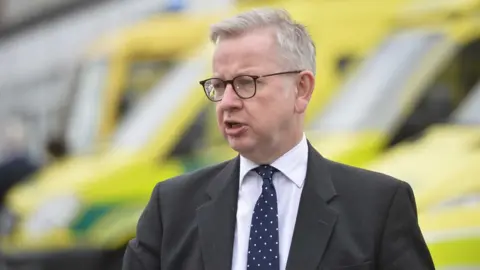 PA Media Minister for the Cabinet Office and Chancellor of the Duchy of Lancaster, Michael Gove, addresses the media during a visit to the Northern Ireland Ambulance head quarters in Belfast.