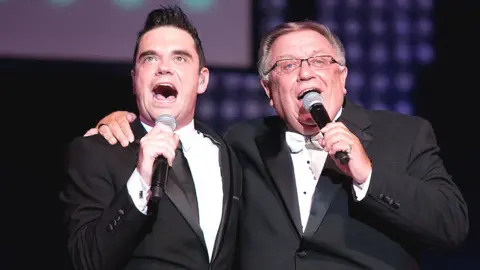 Getty Images Robbie Williams with dad Pete Conway