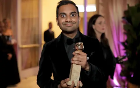 Getty Images Aziz Ansari pictured with his Golden Globe Award