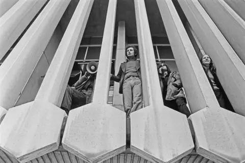 Getty Images Black and white photo of protesters occupying the Centre Point building on 20 January 1974