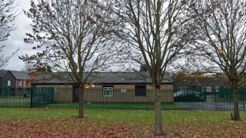 Wheatley Community Library surrounded by a metal fence