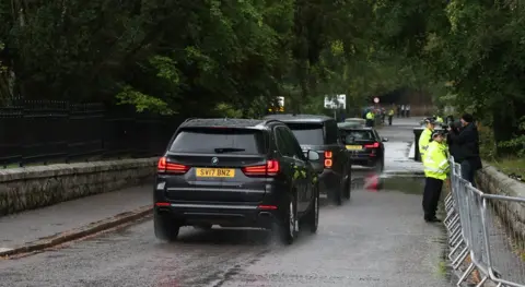 Reuters A motorcade of cars heading to Balmoral