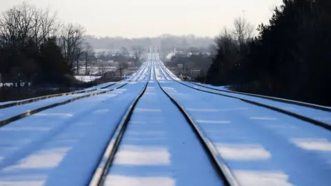 Reuters Train tracks lead towards the camp of First Nations members at a railway crossing