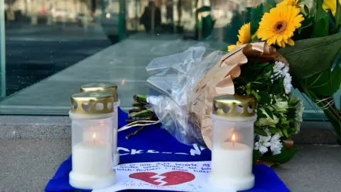 AFP Flowers and candles