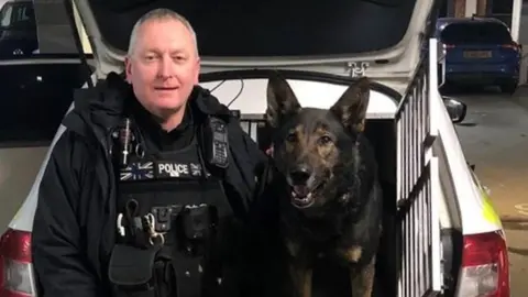 West Midlands Police Handler PC Carl Woodall with police dog Odin
