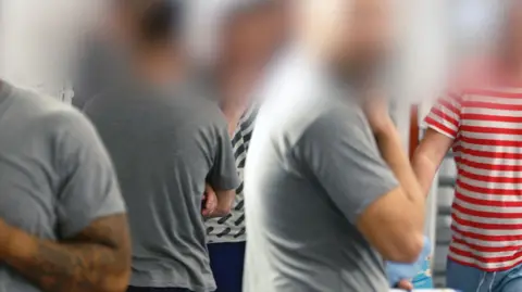 Male prisoners in a UK jail, their faces blurred to protect identities