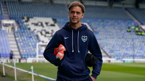 Portsmouth defender Ryley Towler arrives for a game at Fratton Park