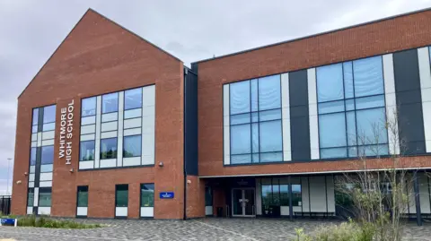 Whitmore High School in Barry is a red brick building 