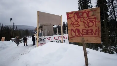 PA A checkpoint is seen at a bridge leading to the Unist"ot"en camp on a remote logging road.