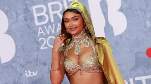 Getty Images Joy Crookes on the red carpet at the Brit Awards