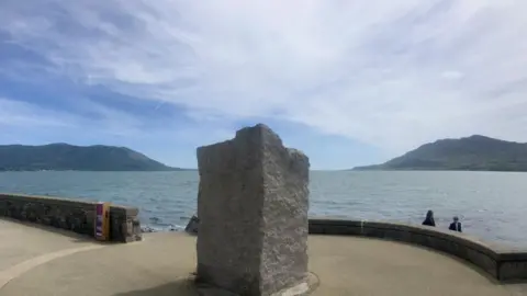 Seafront at Warrenpoint, with mountains in the distance.
