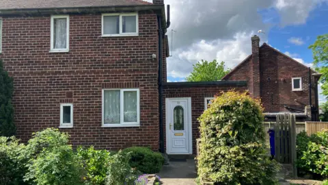 A photo of the exterior of 30 East Drive in Pontefract, a 1950s council home.
