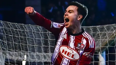 Timur Tutierov punches the air celebrating his goal