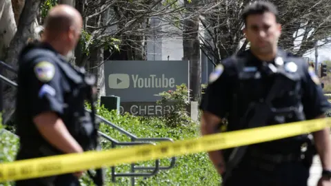 Reuters Police officers and crime scene tape are seen at Youtube headquarters