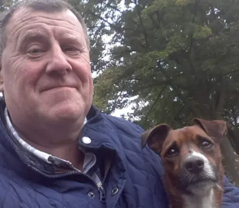 Family handout John Russell with his dog