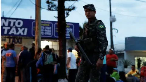 Reuters Brazilian guard at Pacaraima crossing on the Brazilian-Venezuelan border, 28 August 2018