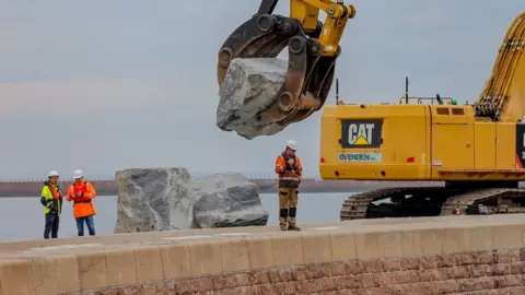 Sunderland City Council Boulder being moved by arm of crane