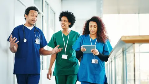 Getty Images Health workers