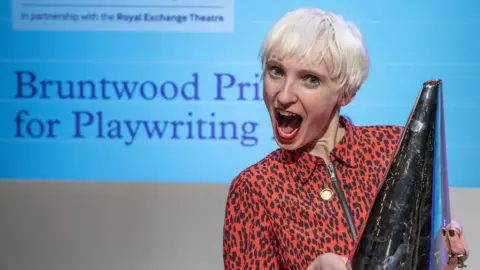 Joel C Fildes Phoebe Eclair-Powell with the Bruntwood Prize