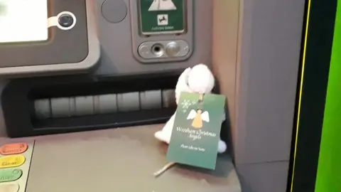 Wrexham Christmas Angels An angel at a cash point