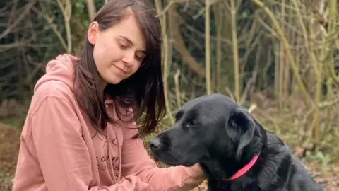 Maisy McAdam and Willow the guide dog