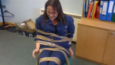 BBC DeeAnn Fitzpatrick claims she was taped to a chair and gagged as a warning