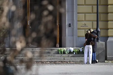 Reuters Mourners outside the school in Malmo