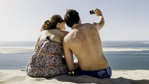 Getty Images Stock image of people taking a selfie in France