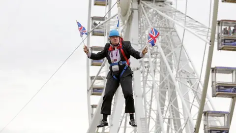 Getty Images Boris Johnson stuck on a zip wire in Victoria Park