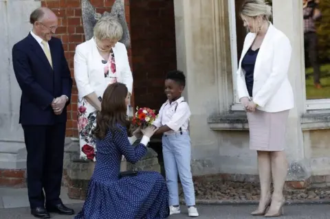 Getty Images Kate, Duchess of Cambridge, is presented with flowers by Lawson Bischoff after visiting the D-Day exhibition at Bletchley Park on 14 May , 2019 in Bletchley, England. The D-Day exhibition marks the 75th anniversary of the D-Day landings