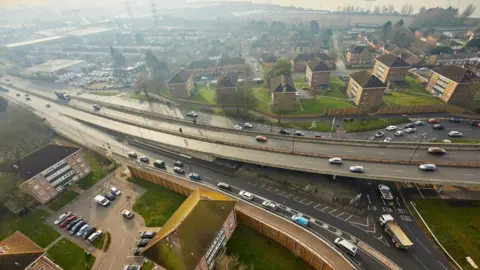Redbridge flyover aerial image shows a large dual carriageway snaking above a large roundabout.