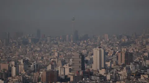 Reuters Image of Tehran's hazy skyline the morning after the strike