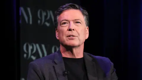  James Comey speaks onstage during Former FBI Director James Comey In Conversation With MSNBC's Nicolle Wallace at 92NY on 30 May 2023 in New York City.