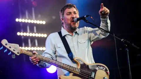 BBC/Nick Pickles Doves frontman Jimi Goodwin peforms at Glastonbury festival in 2014