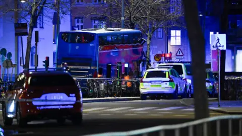 EPA Police, ambulances, and emergency services inspect the scene of a bus crash into a bus shelter in Ostermalm, Stockholm, Sweden, 14 November 2025.