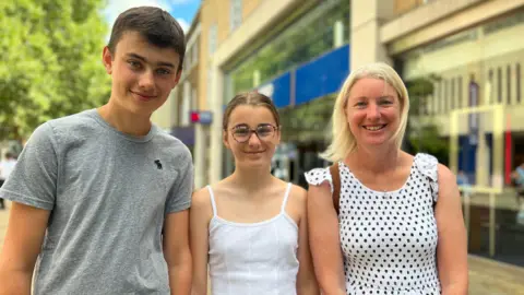 Emma Baugh Tom, Emily and Jennie smiling for the camera 