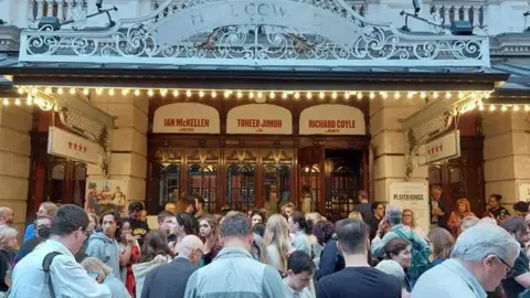 BBC Audience gathered outside the theatre after being evacuated
