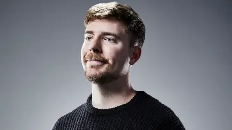 Steven Kahn, MrBeast, a young man with short brown hair and facial hair.