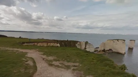 Google Path along the cliff edge with Old Harry Rocks on the right with sea and coastline in the distance