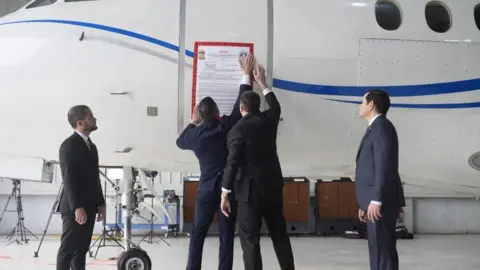 Reuters A "seized" sign is placed on a Venezuelan government airplane during a press conference where U.S. Secretary of State Marco Rubio announced its seizure at La Isabela International Airport in Santo Domingo, Dominican Republic, February 6, 2025